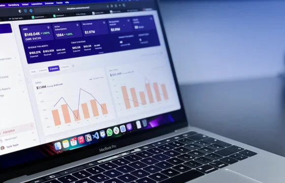 Financial dashboard showing charts and analytics on laptop