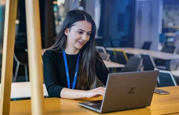 Professional working on laptop managing finance tasks