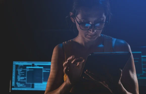 Professional using tablet to access financial data in digital environment