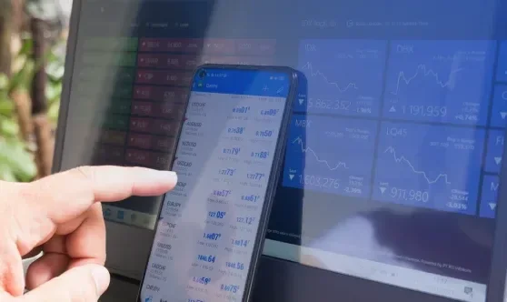 Mobile device displaying financial data dashboard connected to system